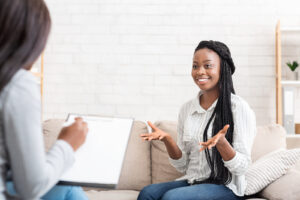 Successful therapy. Happy black female patient talking to psychologist at her office, expressing gratitude. If you're ready to move forward, whole journey wellness is hear to help. Get help with ptsd therapy and trauma treatment in chesapeake, va or ptsd therapy and trauma treatment in richmond, va. We have help you overcome and feel better. Start counseling with us today!