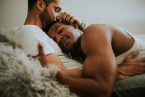 Happy black male couple cuddling together. You deserve to have a therapist that respects your relationship. Relationship counseling can help. Start working with an LGBTQIA+ friendly therapist who working with relationships here. Begin LGBTQIA+ counseling in North Carolina and Virginia soon!